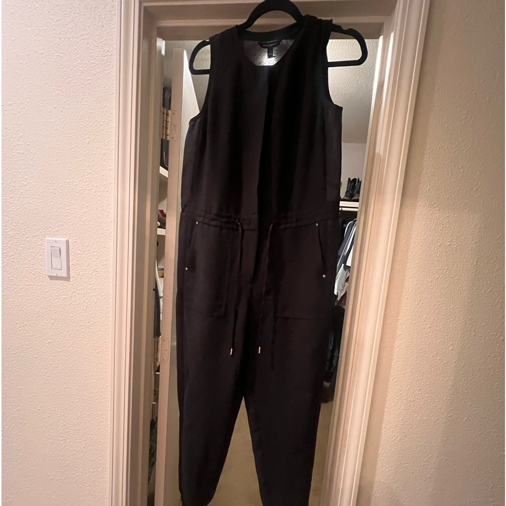 Black jumpsuit with gold buttons, drawstring waist